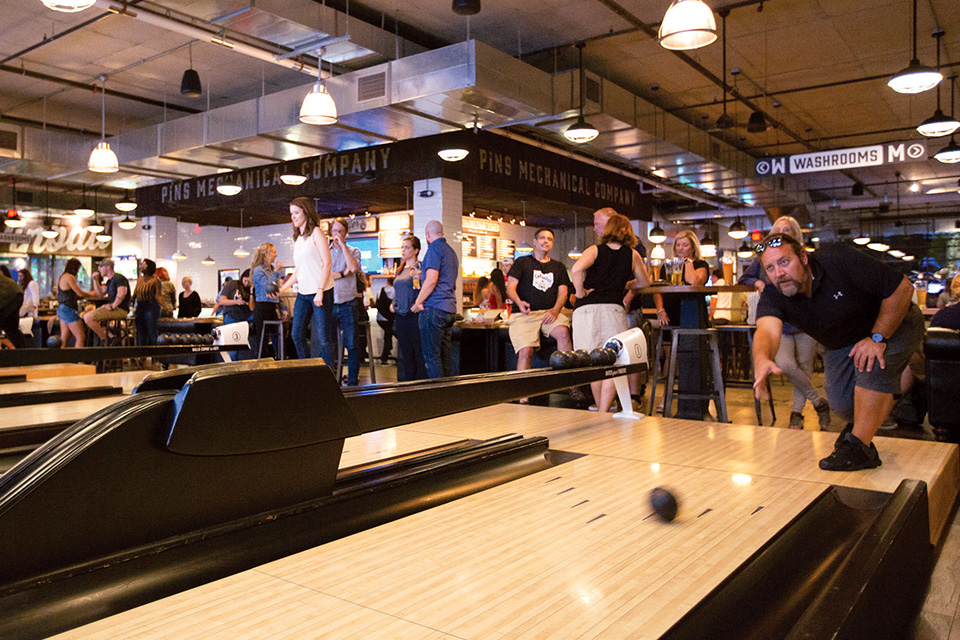 People playing Skee-Ball at Pins Mechanical in Dublin (photo by Nick Fancher)